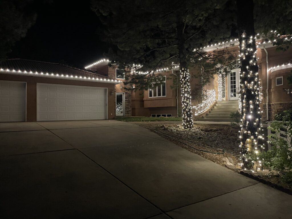 Precision-fit C9 LED holiday lights on a Denver home roofline.